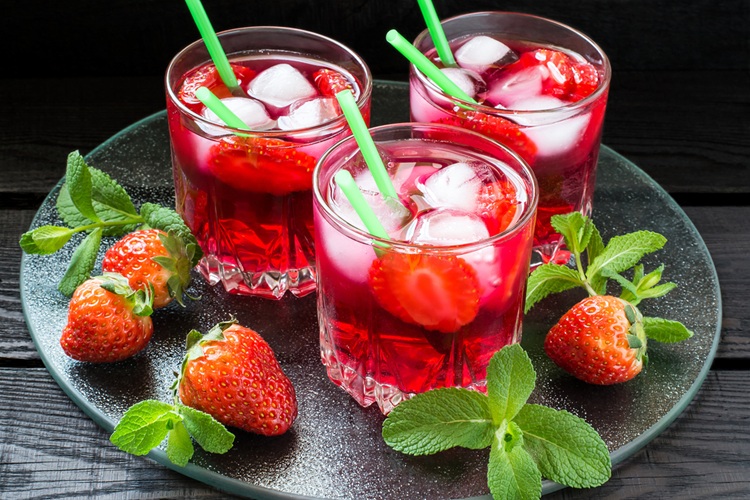 Three,Glasses,Of,Cold,Refreshing,Drink,With,Strawberries,,Ice,And