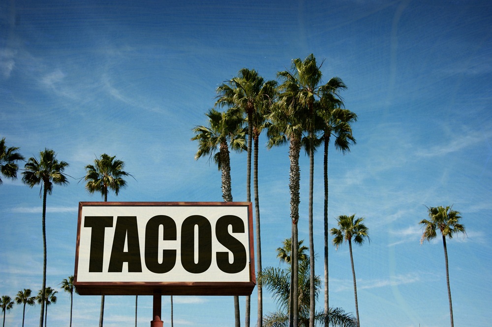 Aged,And,Worn,Tacos,Sign,With,Palm,Trees