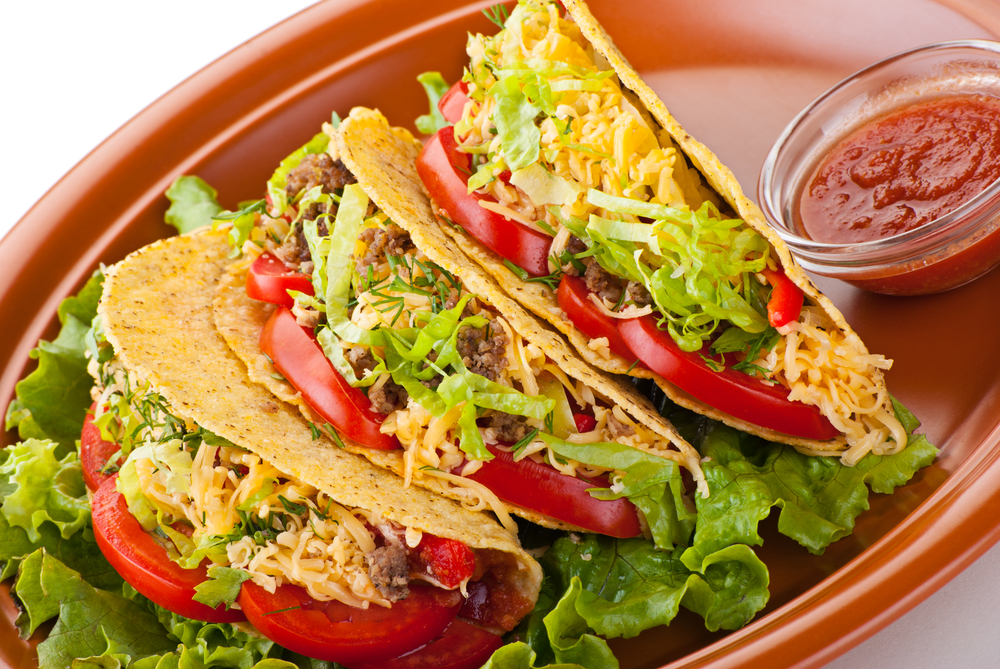 Closeup,Of,Beef,Tacos,Served,With,Salad,And,Fresh,Tomatoes