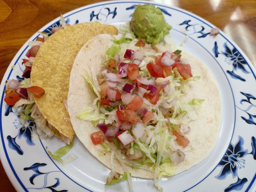 Shrimp taco with a crunchy tortilla and a fish taco with a soft tortilla