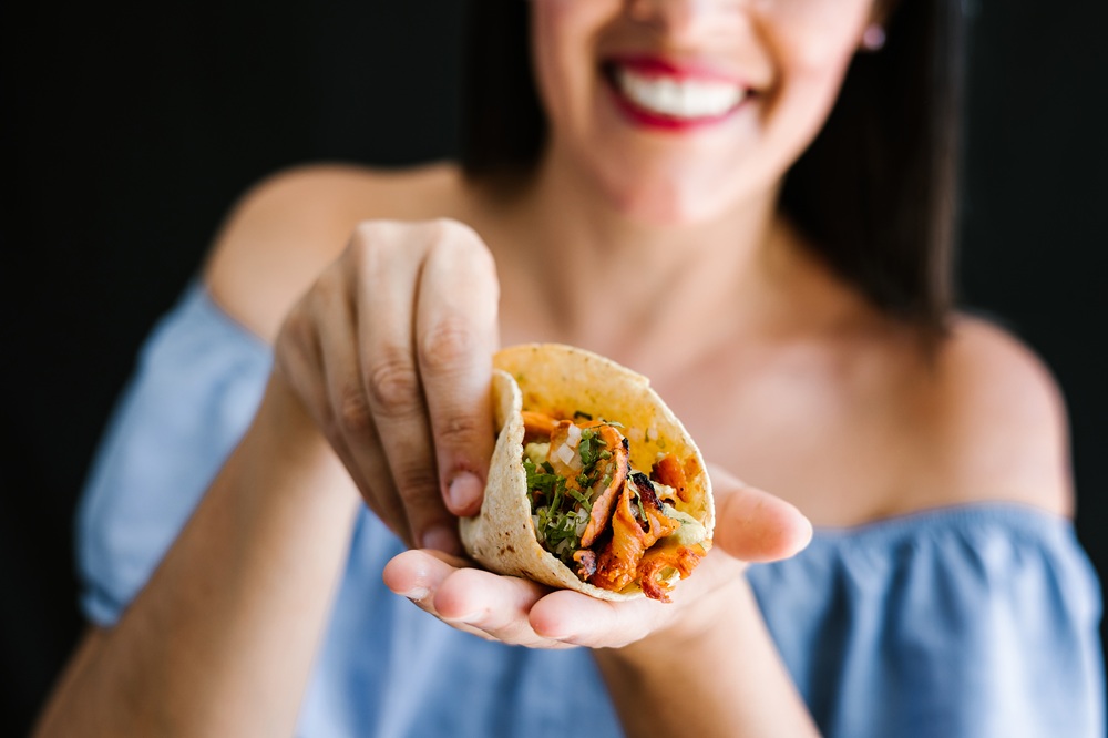 Mexican,Woman,Eating,Tacos,Al,Pastor,,Mexican,Food,In,Mexico