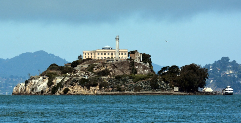 The ominous Alcatraz Island surrounded by the misty waters of San Francisco Bay.