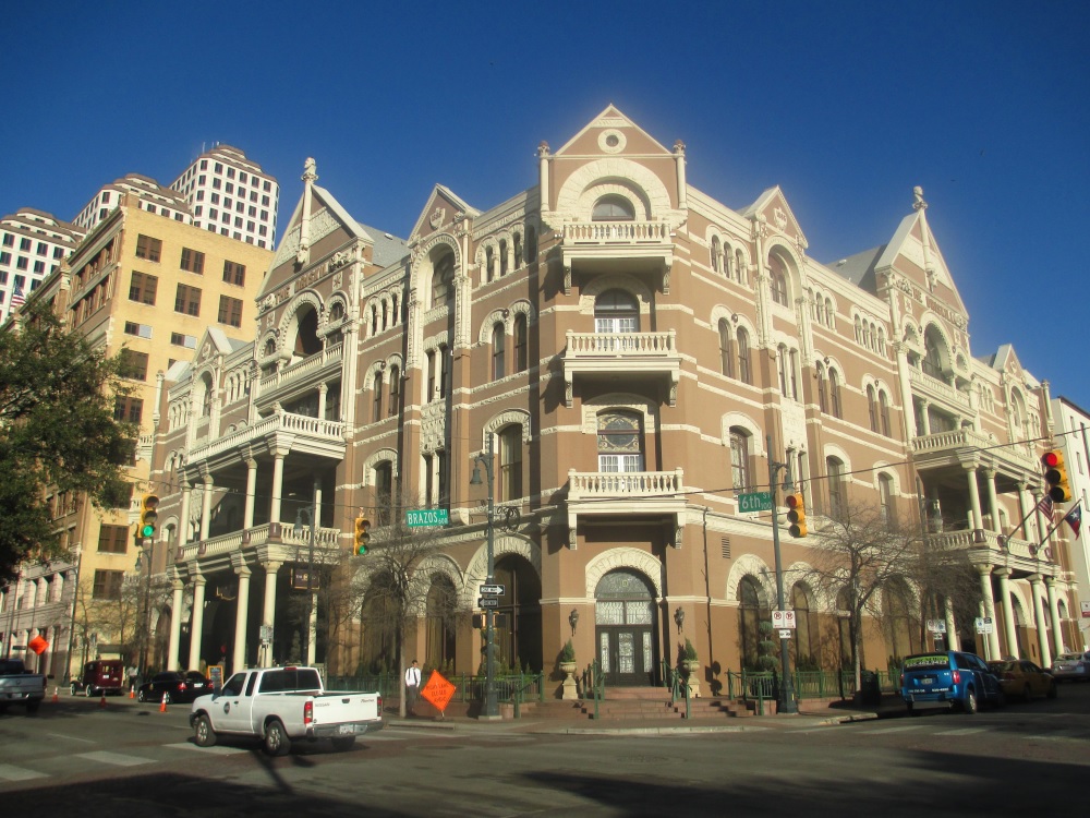 The iconic Driskill Hotel in Austin showcasing its ornate balcony and majestic facade.
