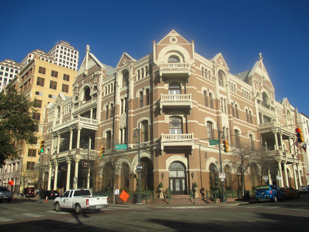 The iconic Driskill Hotel in Austin showcasing its ornate balcony and majestic facade