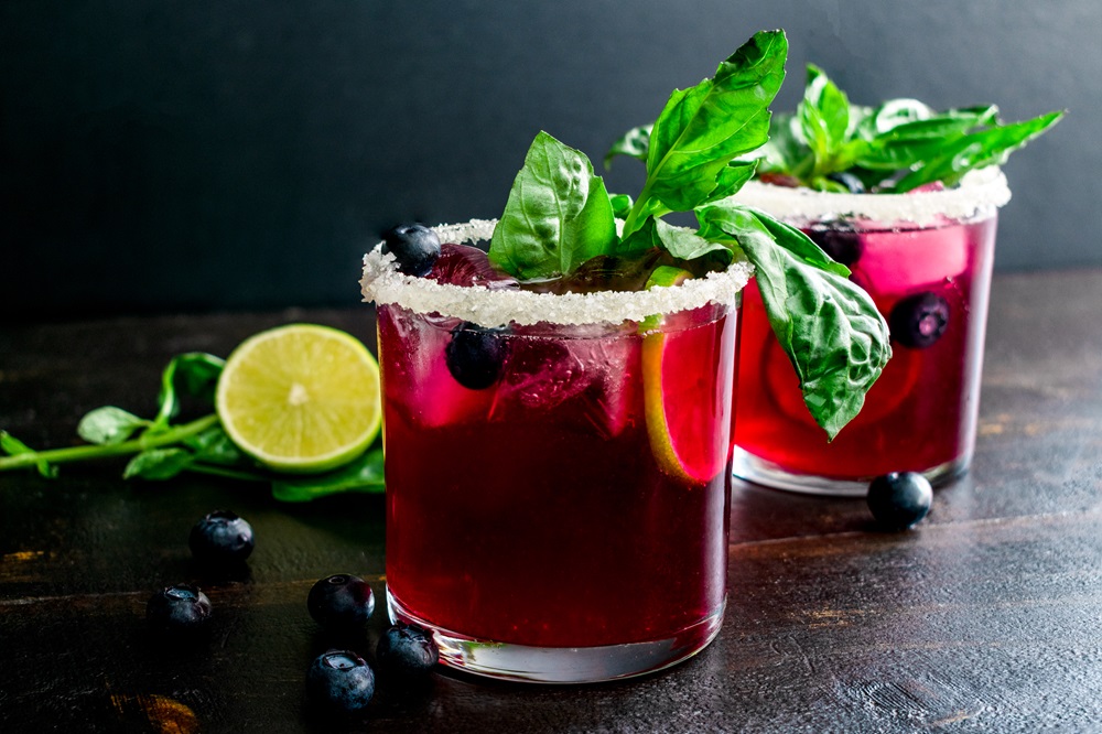 Roasted,Blueberry,Basil,Margaritas,Garnished,With,Fresh,Basil,And,Blueberries:
