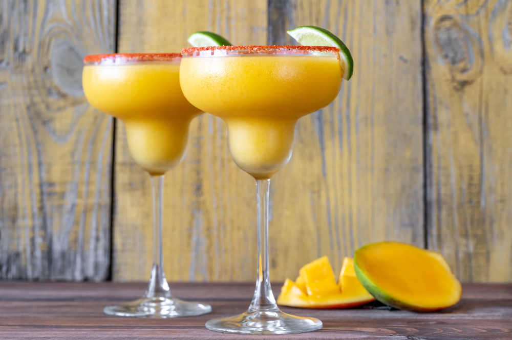 Glasses,Of,Frozen,Mango,Margarita,Cocktails,Garnished,With,Paprika,Salt