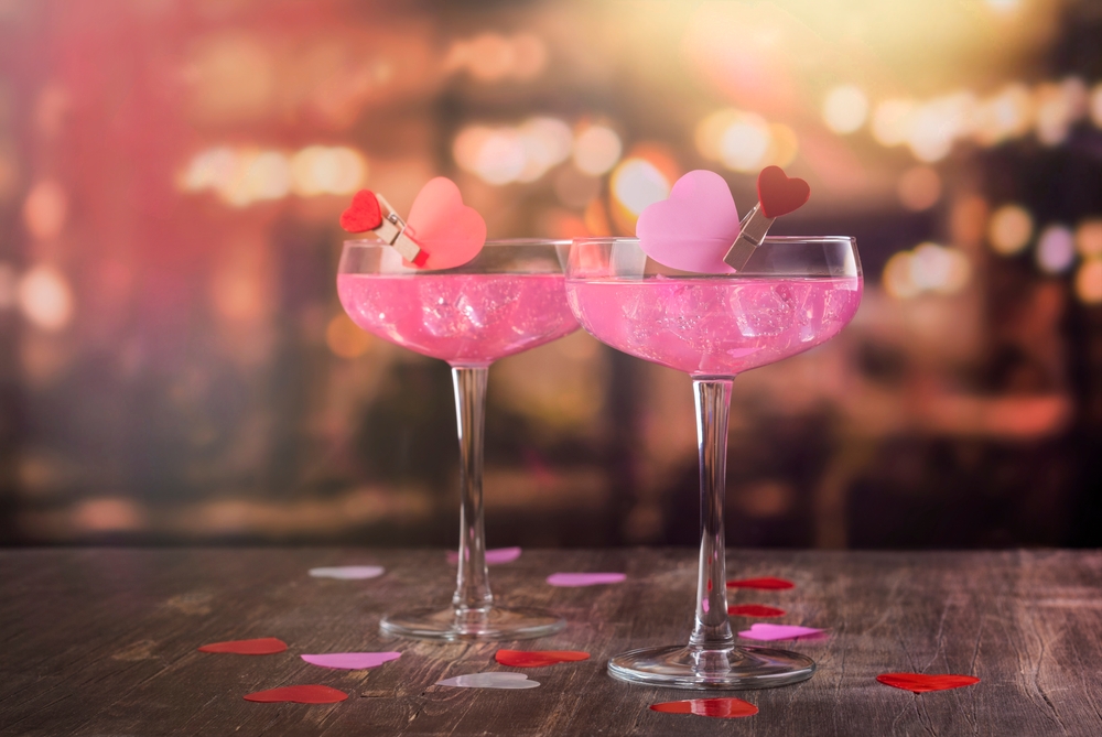 Two,Glasses,With,Pink,Champagne,On,A,Bar,Counter.,Celebration