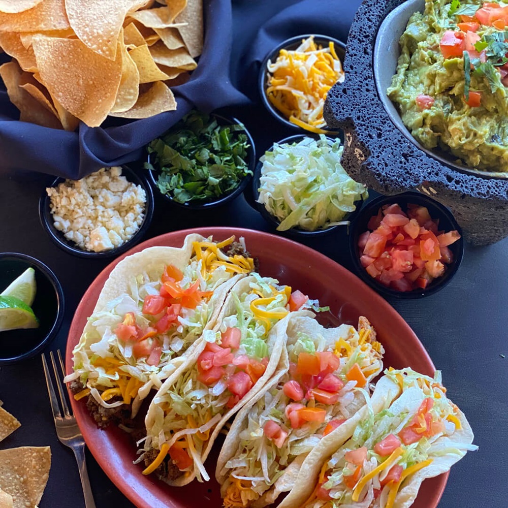 Tacos and guac with chips