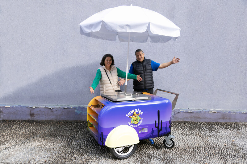 Purple taco cart with white umbrella