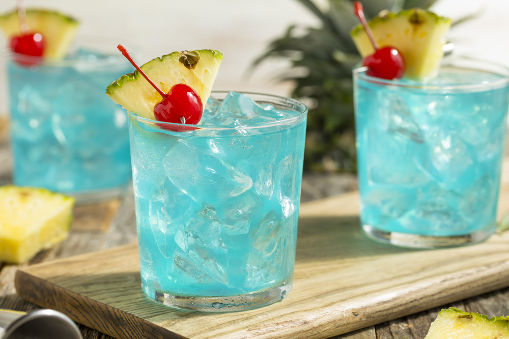 Refreshing,Blue,Hawaii,Cocktail,Punch,With,Pineapple,And,Cherry