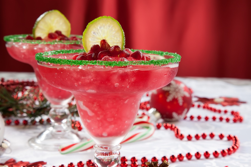 Two,Frozen,Pomegranate,Margaritas,Cocktails,On,Christmas,Decorated,Holiday,Table